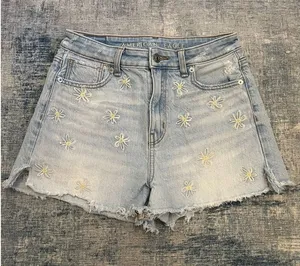 American Eagle Distressed Light Wash Daisy Embroidered Cut Off Mom Shorts Size 0 thumbnail 1