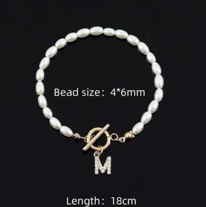 Initial “E” Letter Gold And Pearl Bracelet thumbnail 3
