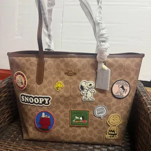 NWT Coach X Peanuts City Tote In Signature Canvas With Patches cbj91 thumbnail 1