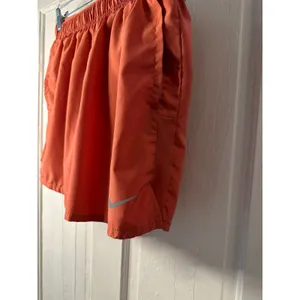 Nike Dri Fit Running Shorts Women Orange Athletic Performance Workout Size L thumbnail 2