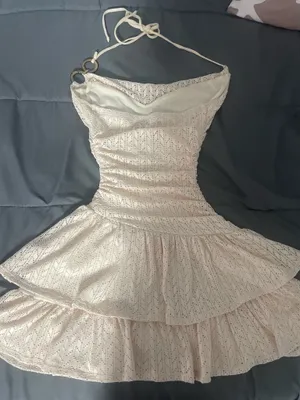 light-colored, halter-neck mini dress with a ruched waist and tiered ruffled skirt. thumbnail 2
