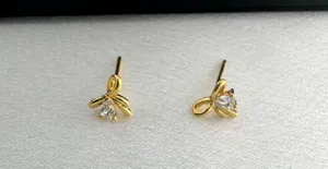 Small CZ Bow Stud Earrings for Women Gold thumbnail 1