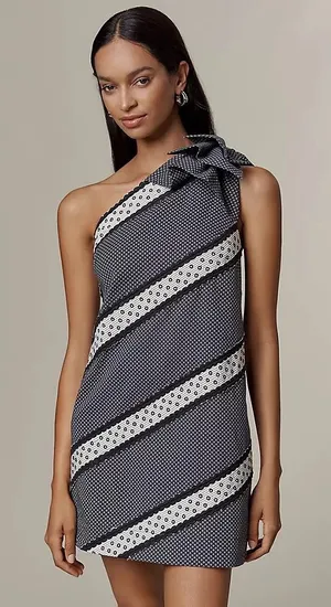 Maeve One-Shoulder Embellished Mini Dress from Anthropologie, featuring a black and white patterned design with a decorative shoulder bow. thumbnail 1