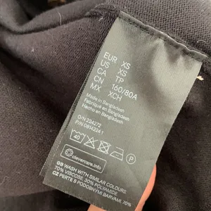H&M black button down sweater jacket fitted and slightly cropped / Size XS thumbnail 3