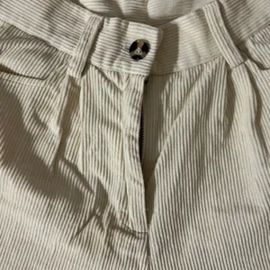 Cream high-waisted corduroy straight leg pants. thumbnail 2