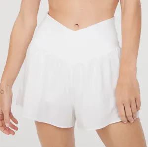 Aerie Offline Real Me Crossover Waist Flowy Shorts in White thumbnail 1