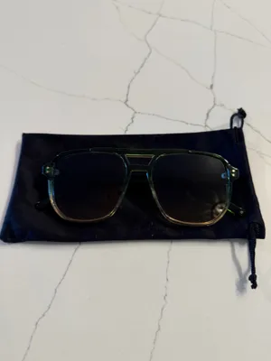 Unbranded Women's Aviator Sunglasses Like New Condition Description: Elevate your accessory collection with these stylish women's aviator-style sunglasses. Featuring translucent green frames and tint-gradient square aviator lenses, these frames offer a chic, modern retro look suitable for any season. Brand: Unbranded Size: One Size Fits Most Condition: Excellent, like-new condition with no scratches, marks, or visible flaws. Includes: Comes with a soft black drawstring protective pouch/case. Carefully packaged and ready to ship promptly! thumbnail 3