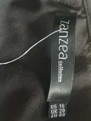 Zanzea Collection black blouse with ruffled sleeves and a flowy silhouette thumbnail 2