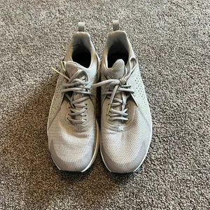 Nike Light Purple Sneakers with Gold Accents and Modern Athletic Design thumbnail 2