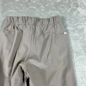 Vuori Miles Ankle Pants Women XS Chia Brown Tapered Joggers Zip Pocket Travel thumbnail 3