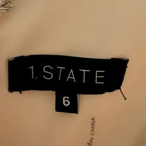 1. State‎ Sleeveless V-neck Side Tie Jumpsuit in Cream thumbnail 7
