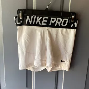 Women’s white nike pros thumbnail 1