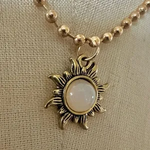 Gold tone sun pendant necklace thumbnail 3