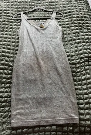 Silver metallic bodycon dress with a V-neckline and spaghetti straps. Size: S #glamour #party #bodycon thumbnail 1