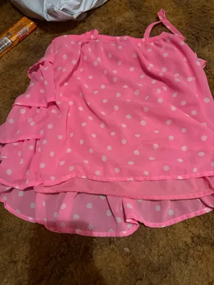 Lightweight pink tank with white polka dots. Features layered ruffle tiers and thin adjustable straps. Flows and feminine silhouette. Great for warm-weather styling. thumbnail 2