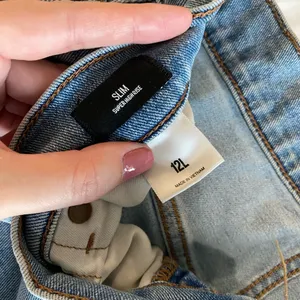 Express Super High Waisted Light Wash Raw Hem Slim Jeans thumbnail 3