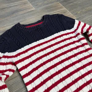 Vintage Tommy Hilfiger nautical fisherman cable knit sweater with red and white stripes at the hem and navy blue upper 100% cotton Made in Japan size small Has some minor yellowing spots as pictured barely noticeable on the hem and on the sleeves Ptp 15” Waist 13.5” Length 22” Inseam 19.25” Stretchy fabric #preppy #vintage #cableknit #fisherman #nautical thumbnail 2