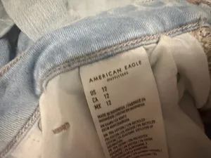 American eagle light wash next level stretch mid rise jean shorts size 12 thumbnail 5