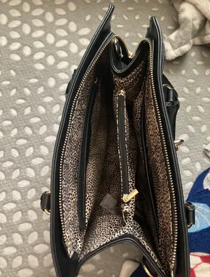 Black handbag/crossbody with red and white stipe Cheetah print interior design Plenty of zippers thumbnail 4