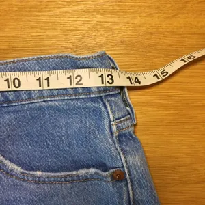 Levi’s 501 Jean shorts 26 button-fly medium wash distressed thumbnail 4