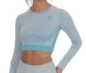 Gymshark Women's Teal and Gray Long Sleeve Crop Top Size Small . Stylish long sleeve crop top by Gymshark. Features a sleek teal and gray design. Perfect for workouts.. NWT thumbnail 1