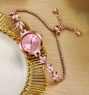 Brand New Pink and rose gold watch with floral charm thumbnail 1