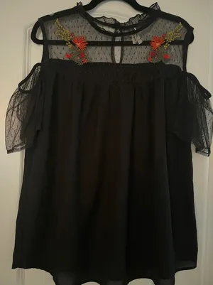 Black off the shoulder top with sheer mesh sleeves and embroidered flowers thumbnail 1