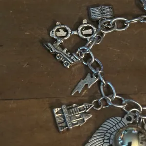 Silver tone charm bracelet with assorted charms thumbnail 5