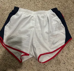 White Nike Dri-Fit Running Shorts with navy and red detail thumbnail 1
