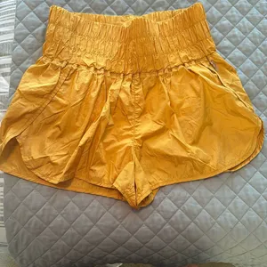 Free People Yellow Athletic Shorts with Elastic Waistband and Flowy Design thumbnail 1