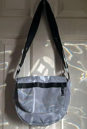 LL Bean purse in gray. The lighting is from the sun through the door. No stains thumbnail 1