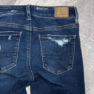 American Eagle AEO Dark Wash Jegging Jeans Womens 0 Reg High Rise Ripped Raw Hem thumbnail 6