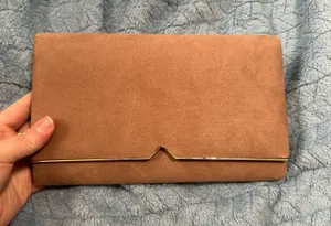Soft suede envelope clutch with gold-tone accent along the flap. Elegant, minimalist design. Versatile for day or evening wear. thumbnail 1