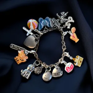 Silver tone loaded charm bracelet thumbnail 1