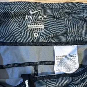 Nike Dri-FIT Capri running leggings with a black and gray geometric print and me thumbnail 3