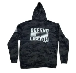 Howitzer "Defend Liberty" Black Camo Hoodie Elevate your casual wear with this rugged and patriotic Howitzer "Defend Liberty" Hoodie. Featuring a stealthy black multicam (camo) pattern, this hoodie is designed for those who value both style and a strong message of freedom. Constructed with high-quality, durable fabric, it offers a comfortable fit perfect for outdoor adventures, range days, or daily wear. Product Features: • Brand: Howitzer Manufacturing Co. • Design: Bold "DEFEND LIBERTY" distressed graphic with the American flag and an AR-15 silhouette on the front. • Back Detail: A vertical "DEFEND LIBERTY" spine graphic for a unique look from every angle. • Sleeve Detail: Features the Howitzer brand American flag patch on the sleeve. • Pattern: Modern black/dark grey camouflage. • Style: Pullover with adjustable drawstring hood and a spacious kangaroo front pocket. thumbnail 5