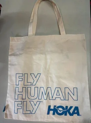 Hoka fly human fly canvas tote bag thumbnail 1