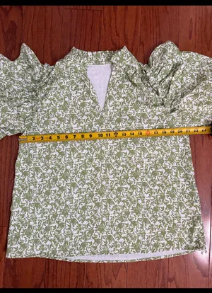 Green & white floral Boho Blouse with ruffled Puff sleeves- Size Medium. ***Refer to measurements. Gently warn and excellent condition. Measurements approximately 21” x 24” long. Material is 100% polyester. Non-smoking home . Priced at as is condition. Don’t like my price make a reasonable offer! And thank you for checking my closet! thumbnail 6