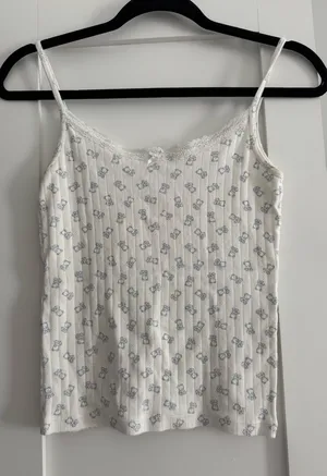 Brandy Melville Cream Cami with Small Blue Floral Print thumbnail 1