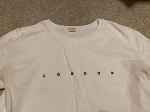 Brandy Melville “London” White Baby Tee thumbnail 2