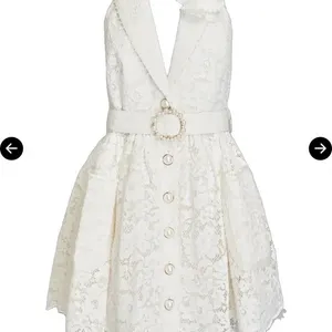peekskill brand Chic Zimmermann mini dress in cream lace. Features a halter neckline and button details. Ideal for elegant occasions thumbnail 1
