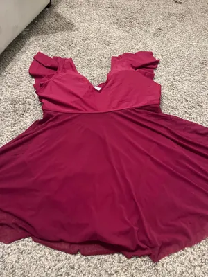 Stylish red swim dress with a flattering wrap design. Perfect for beach outings. thumbnail 9