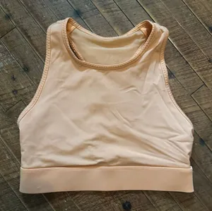 Fabletics Orange high neck XS athleisure wireless sports bra thumbnail 1