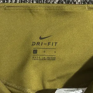 Nike NEW Dri-Fit Mid Rise 7/8 Length Leggings Olive thumbnail 4