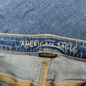 American Eagle Super Hi-Rise Flare Jeans Blue Distressed Raw Hem Women 10‎ Reg thumbnail 6