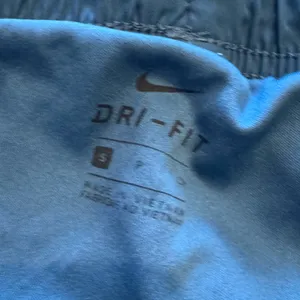 Nike Women's Drifit Athletic Shorts in Blue and White lined thumbnail 2