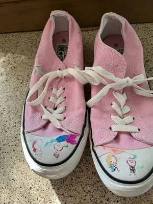 Converse women's pink size 6.5 in good condition In front of shoe picture of kids were painted thumbnail 1