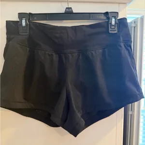 This is a pair of black Lululemon Final Lap running shorts! size 6! thumbnail 1