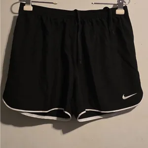 Nike Women's Black Athletic Mesh Shorts with White Trim thumbnail 5