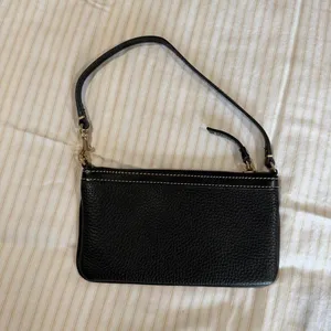 Dooney & Bourke black pebbled leather slim zippered wristlet with gold hardware thumbnail 3